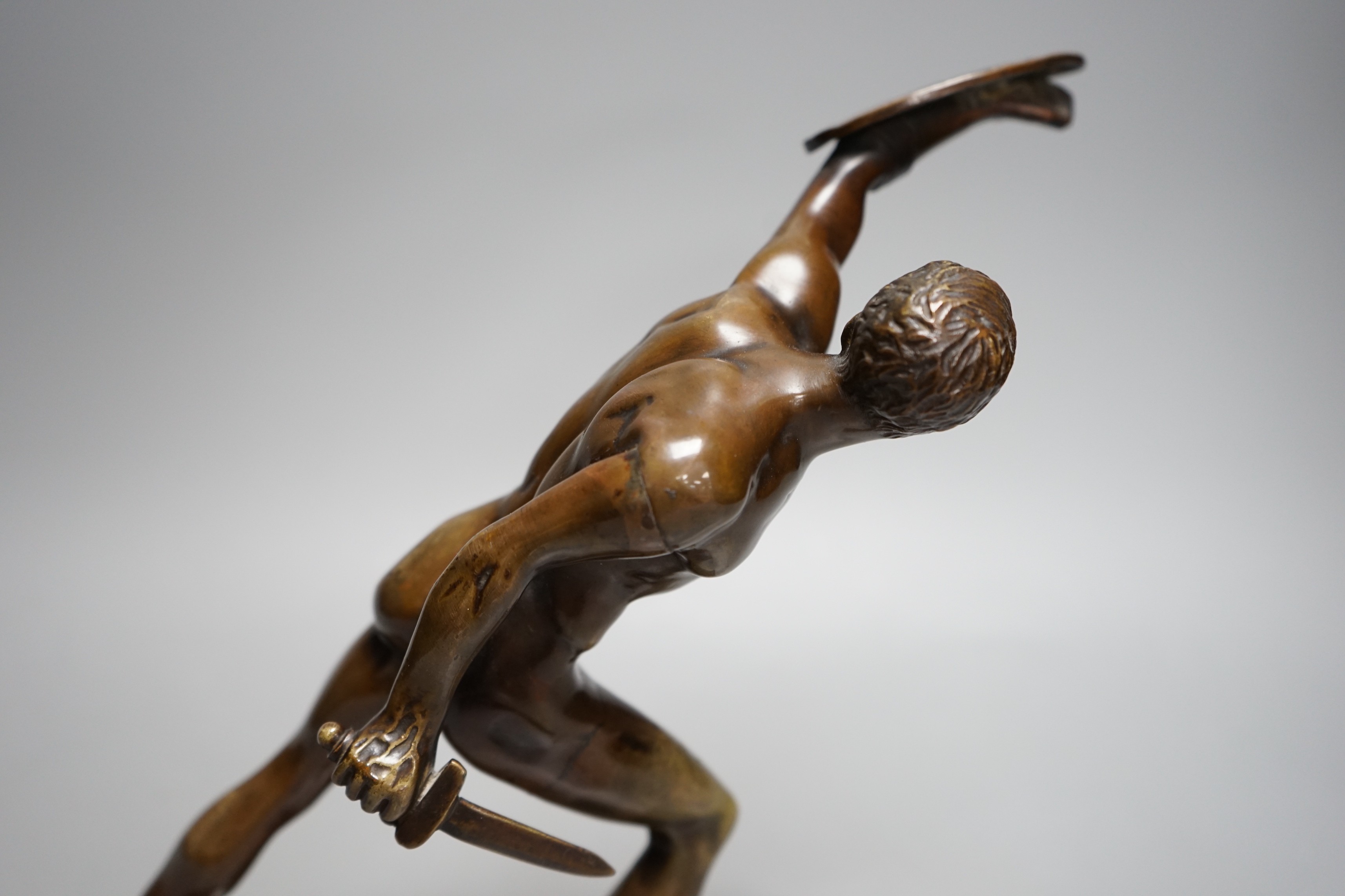 After the Antique, an early 20th century bronze study of the Borghese Gladiator, on marble base, 26cm tall